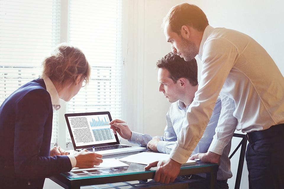 MBA Students studying at a computer